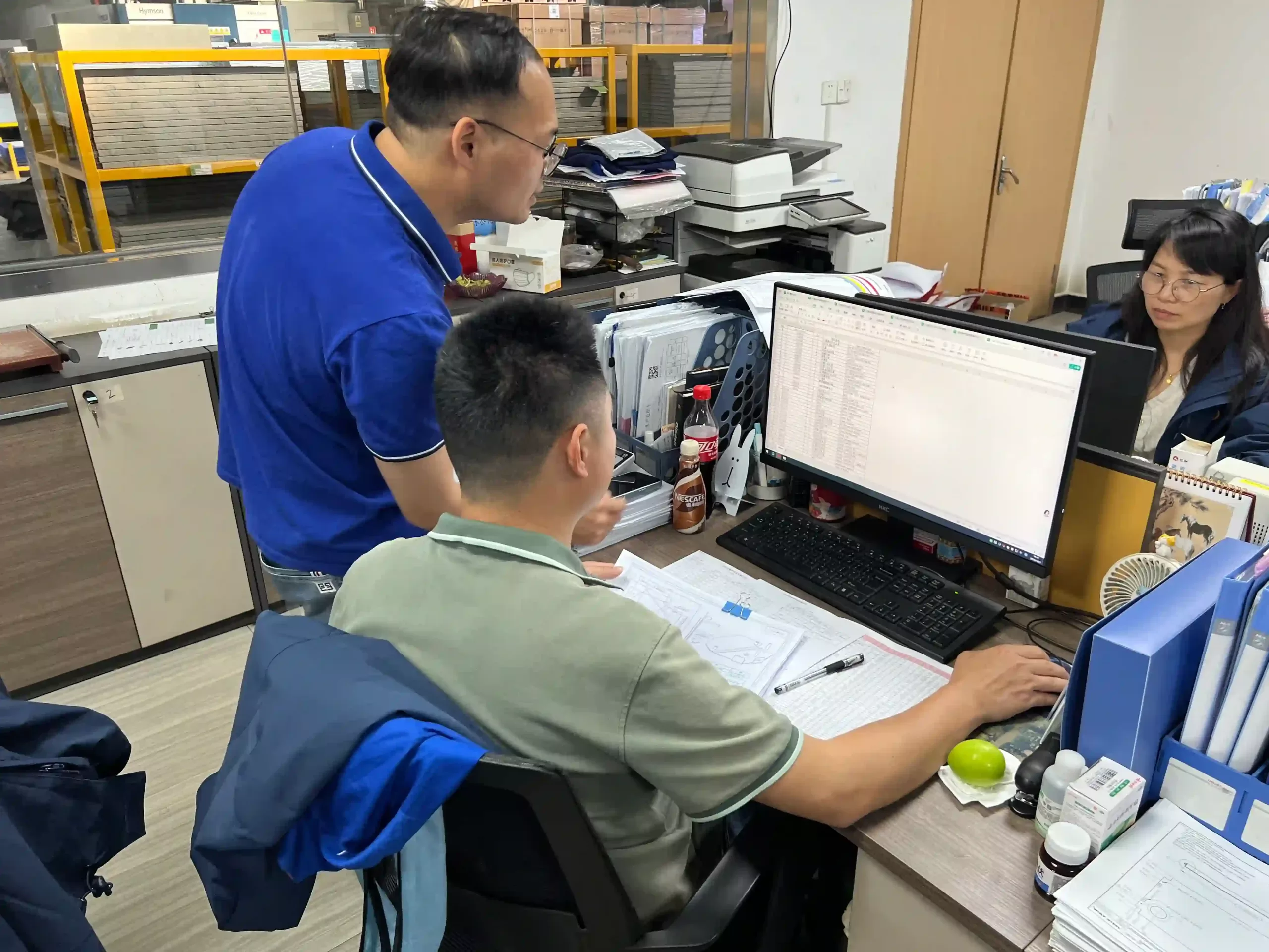 Workshop supervisor coordinating production