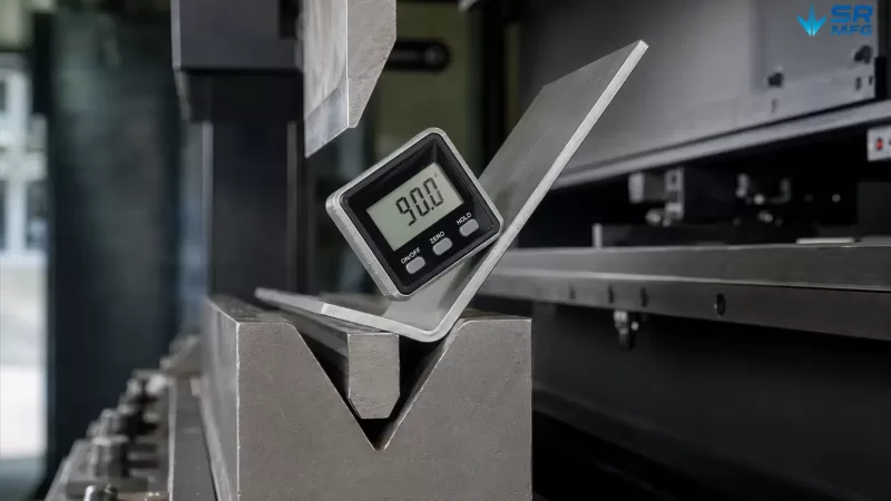 Digital angle gauge measuring bend accuracy on a sheet metal bracket during press brake forming inspection