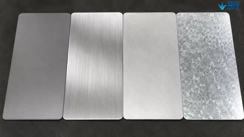 Sheet metal material samples showing cold rolled steel, 304 stainless steel, aluminum 5052, and galvanized steel surface textures